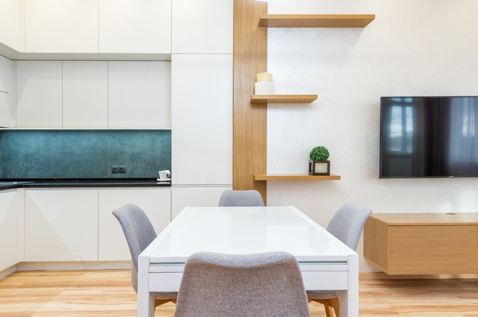 Modern wood custom dining table in a beautifully lit room